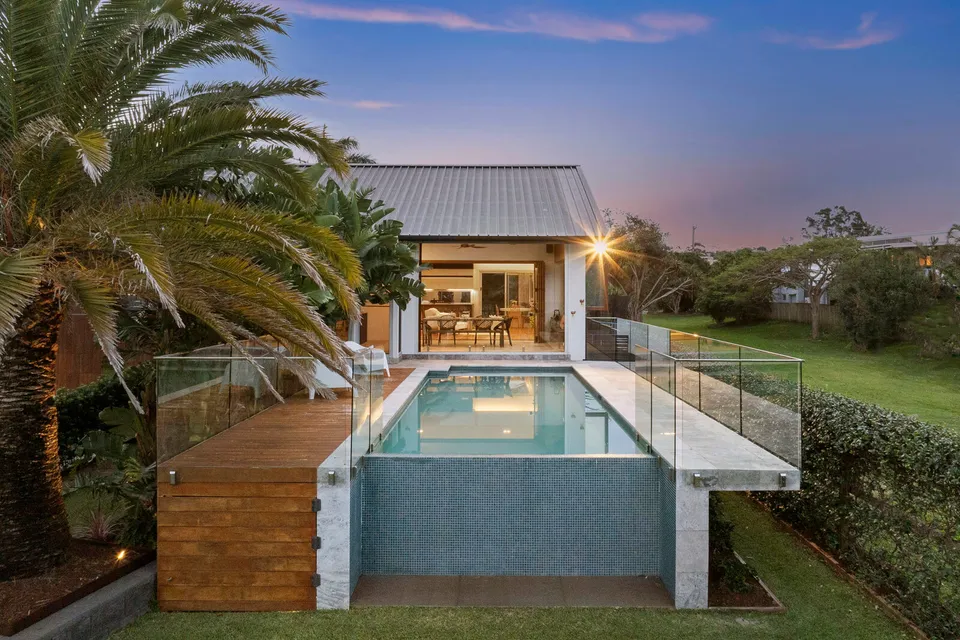 The Causeway House - Heritage beach house renovation with seamless indoor-outdoor living and infinity pool integration