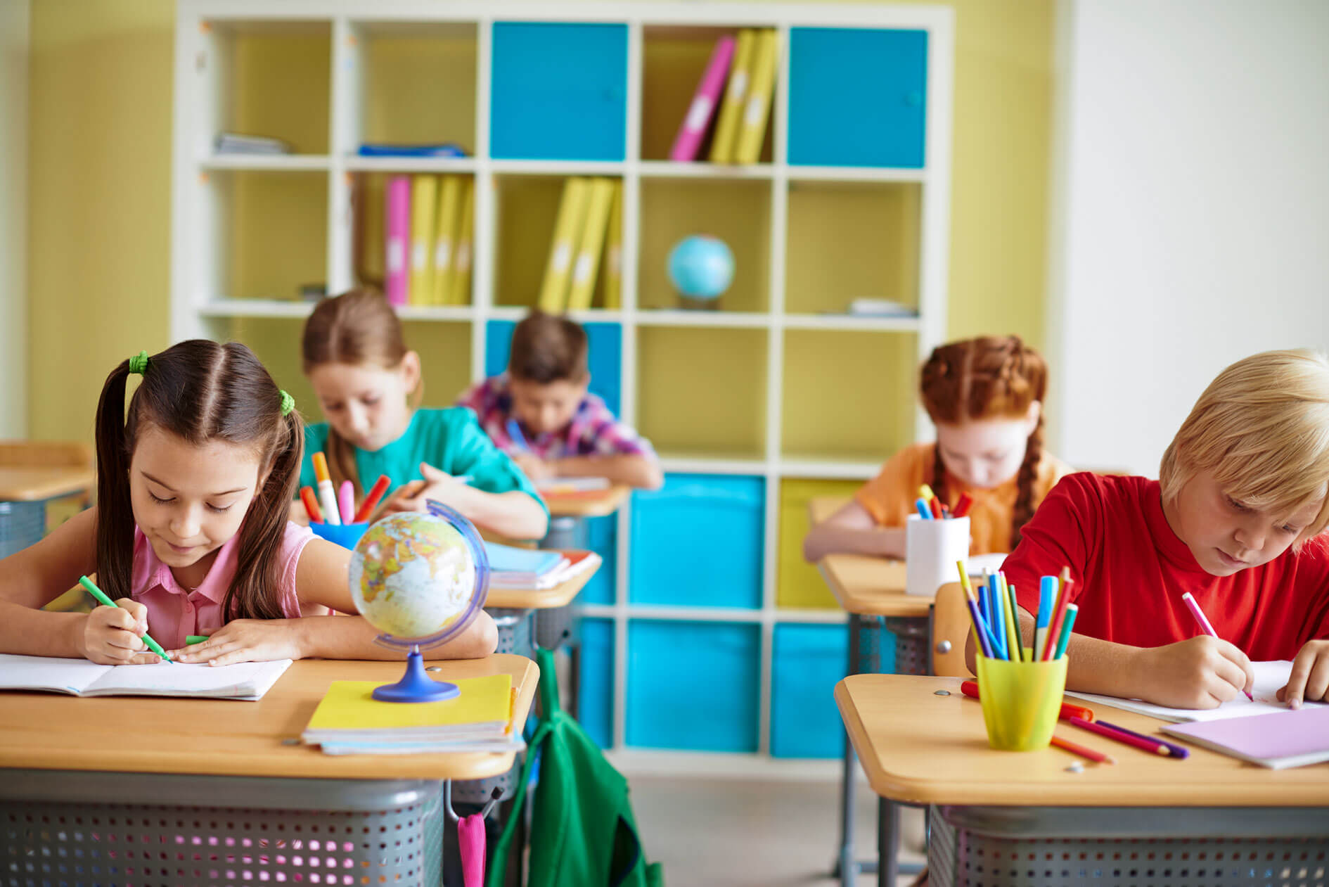 Color zoning in an open-plan Gold Coast Queensland school showing how different hues are used to separate functional areas while maintaining spatial flow.