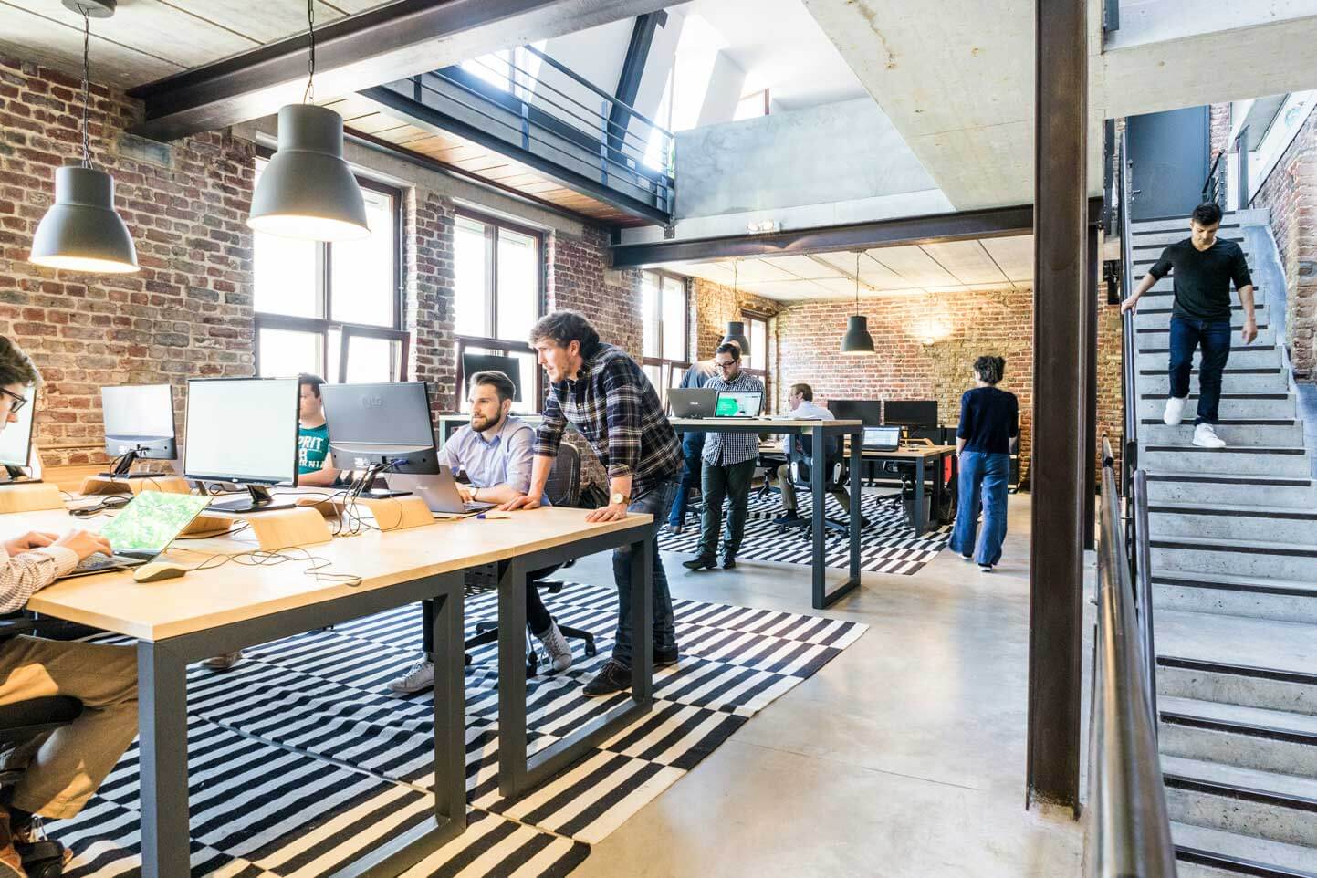 Open office space with flexible layout and industrial design elements